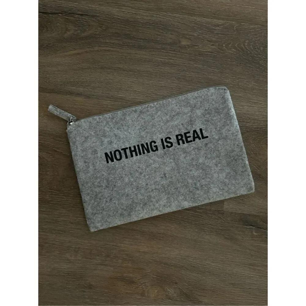 Slnghr Zip Clutch Bag Nothing Is Real
